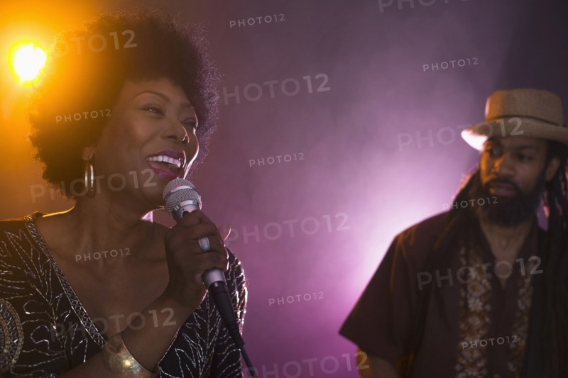 Singer and musician performing on stage