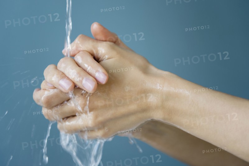 Close up of mixed race woman washing her hands