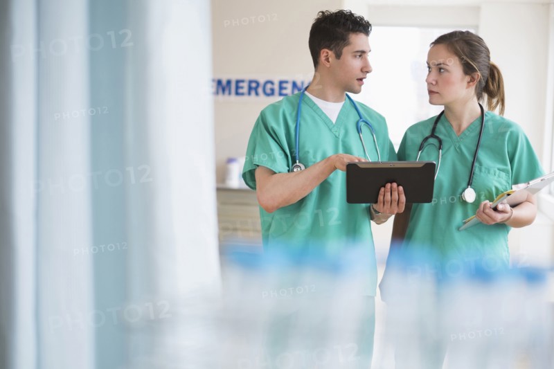Doctors talking in hospital emergency room