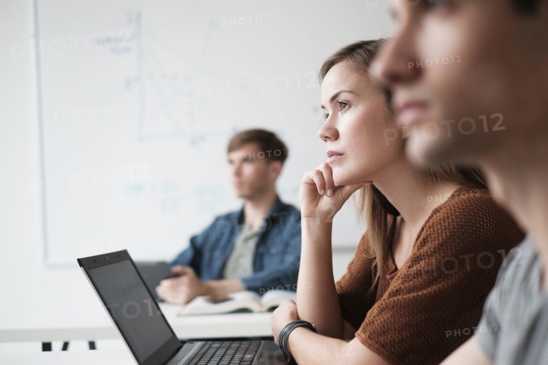 Student listening in college classroom