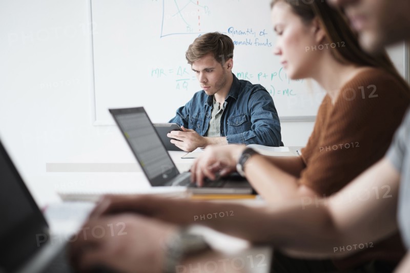 Students working in college classroom