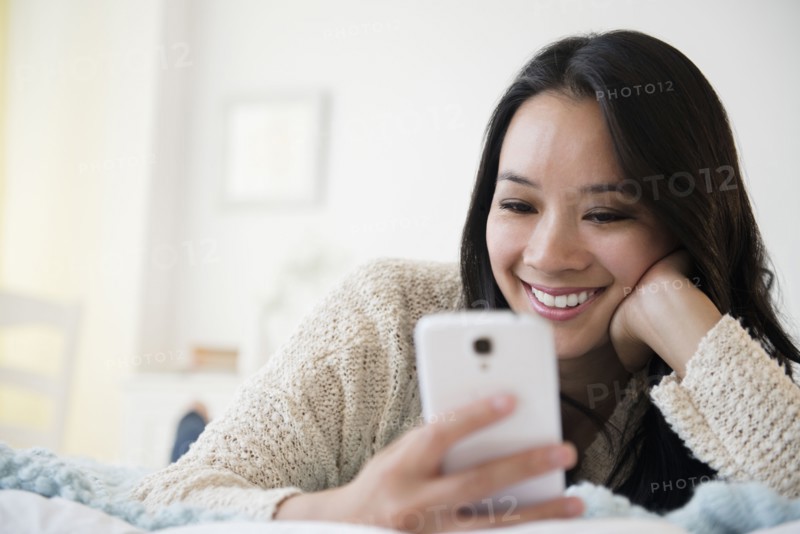 Chinese woman using cell phone