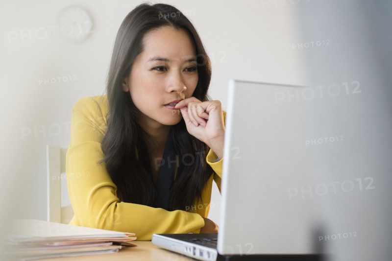 Chinese businesswoman using laptop