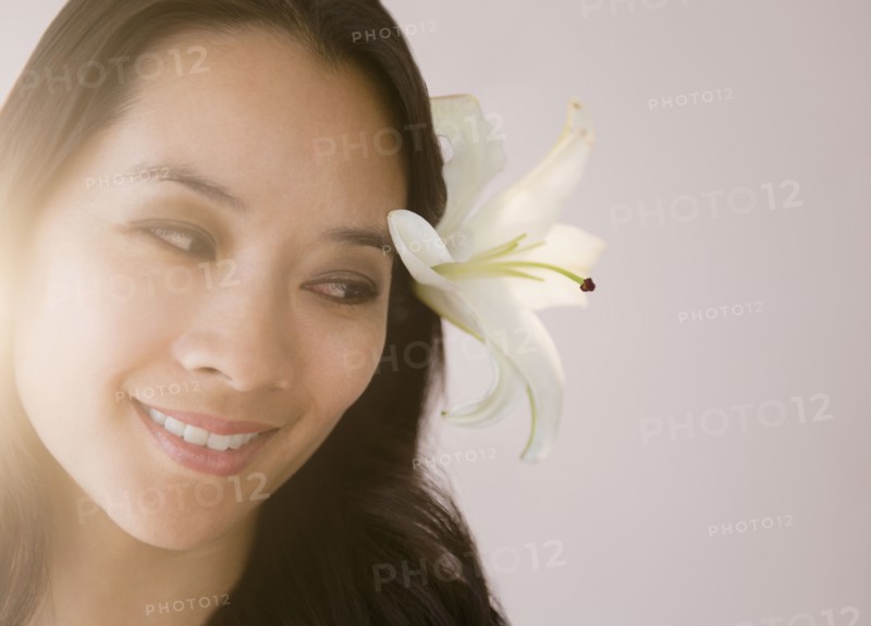 Chinese woman wearing flower in her hair