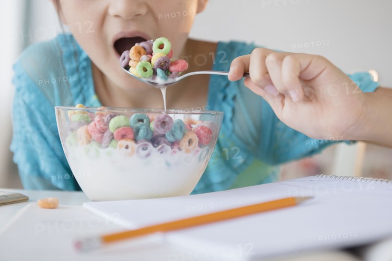 Girl eating bowl of cereal