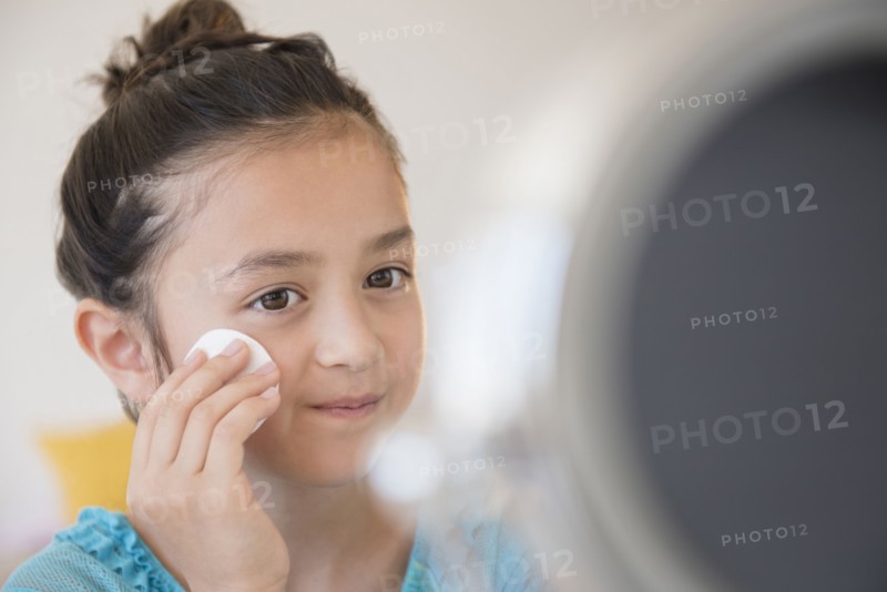 Girl washing her face