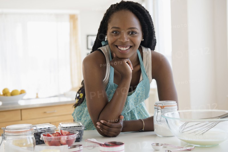 Black woman baking in kitchen