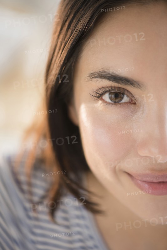 Close up of face of smiling Hispanic woman