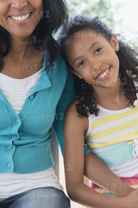 Mother and daughter smiling