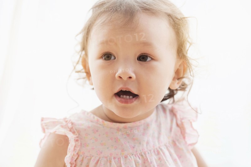 Mixed race baby girl with mouth open
