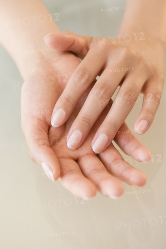 Close up of hands of Hispanic woman
