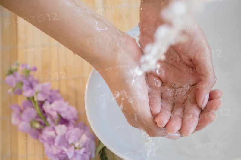 Hispanic woman washing hands