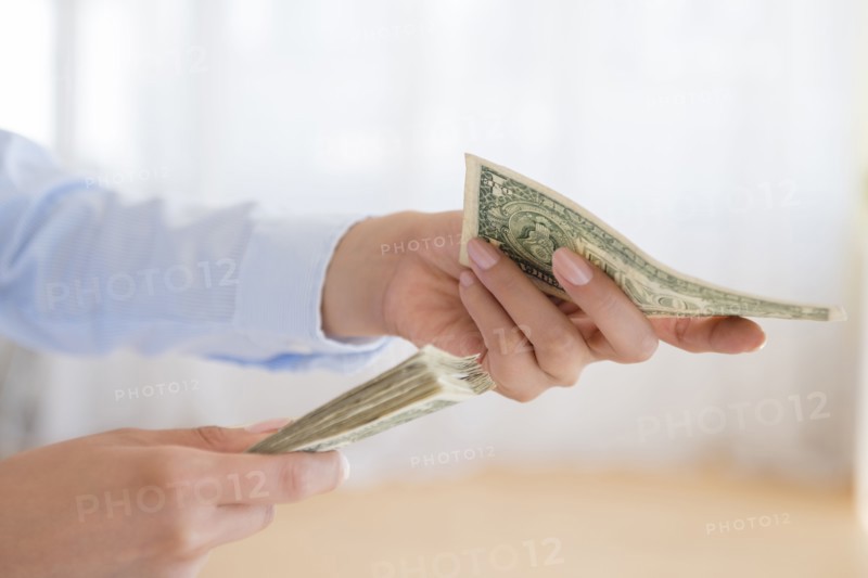 Hispanic woman counting money