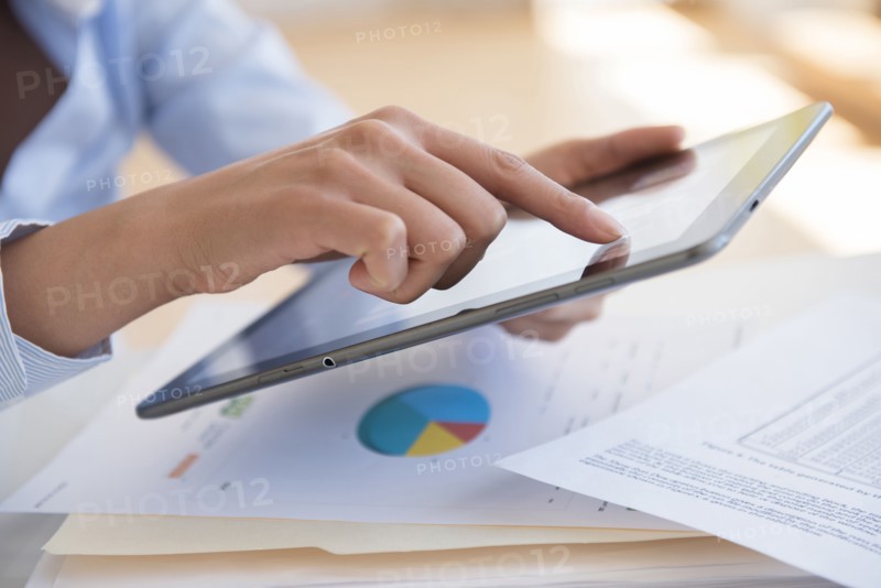 Hispanic businesswoman using digital tablet