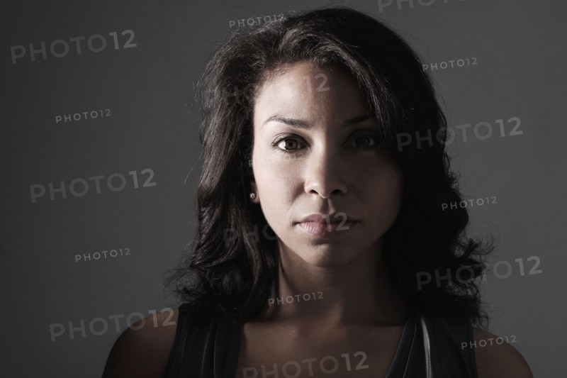 Mixed race woman with serious expression