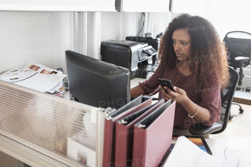 Black businesswoman working at office desk