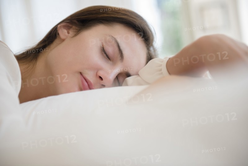 Native American woman sleeping in bed
