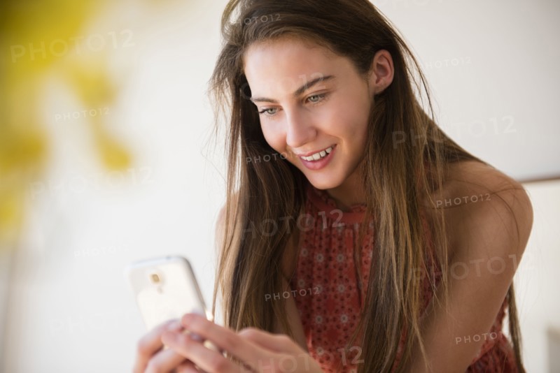 Native American woman using cell phone