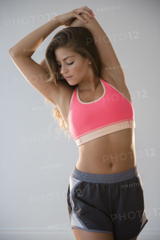 Mixed race dancer stretching