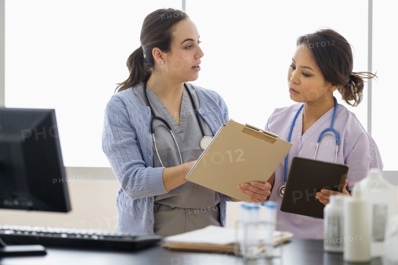 Doctor and nurse talking in hospital