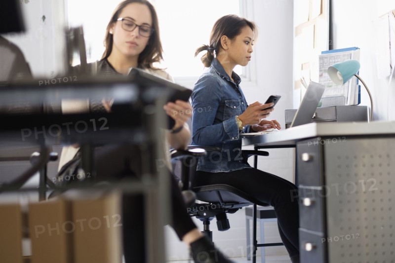 Businesswoman using digital tablet in office