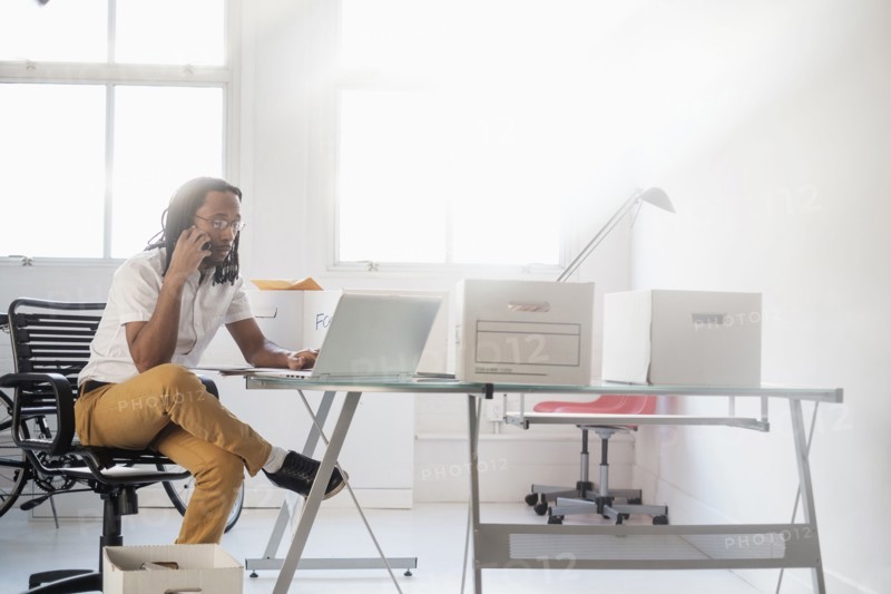 Black businessman working in new office