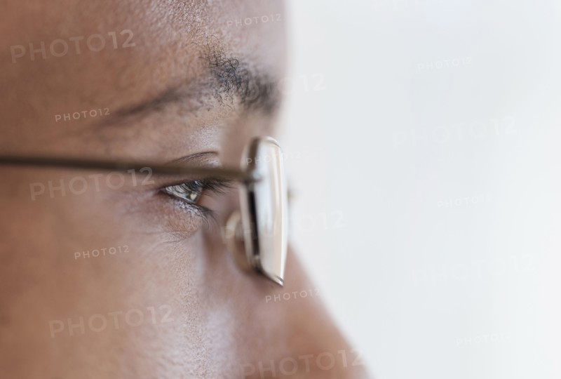 Close up profile of eyes and eyeglasses of Black man