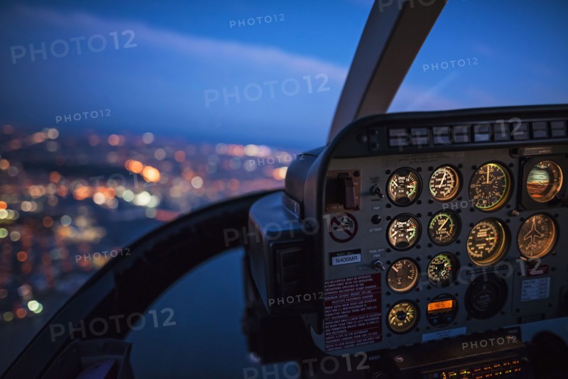 Close up of control panel of airplane flying at night