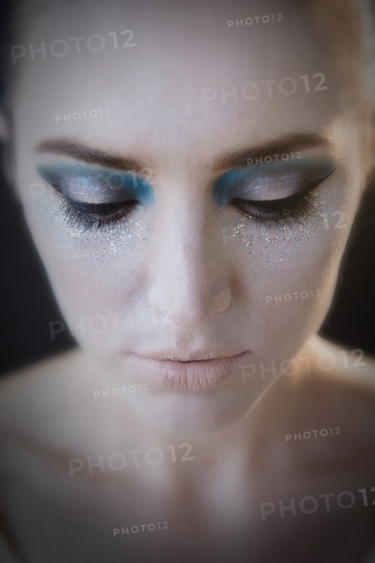Caucasian woman wearing glamorous makeup