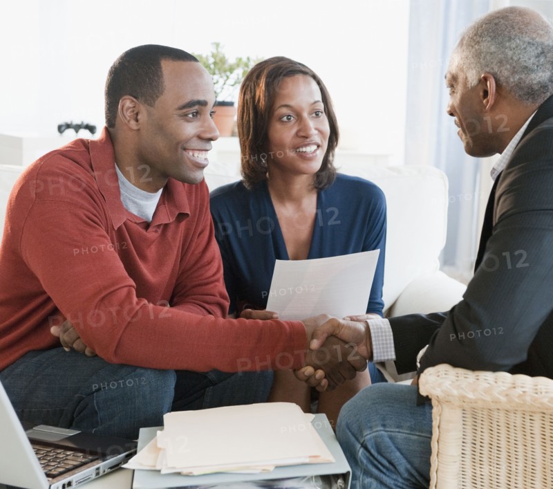 African American couple talking with financial advisor