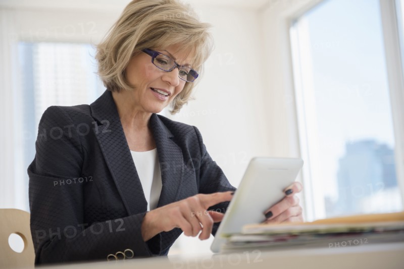 Caucasian businesswoman using digital tablet