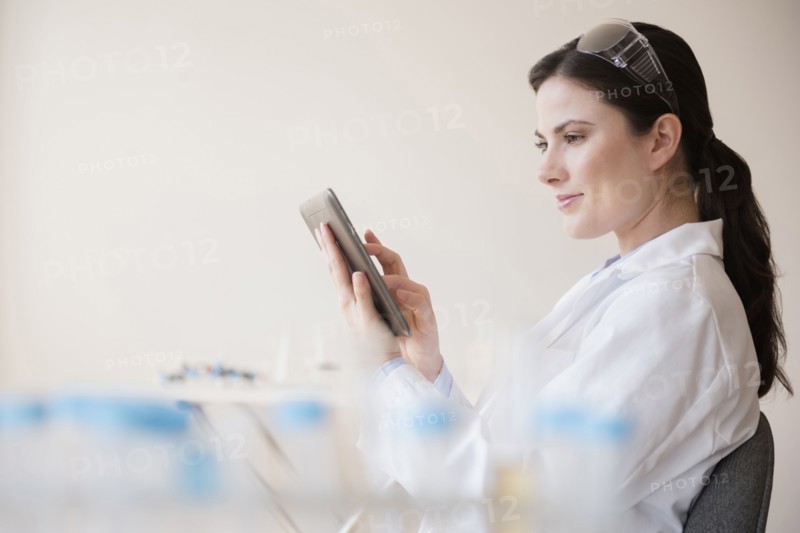Caucasian scientist using digital tablet