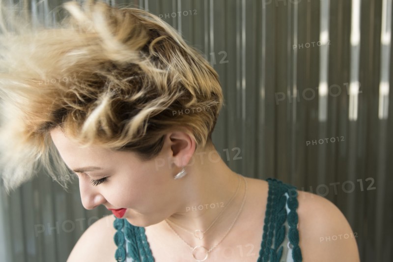 Caucasian woman tossing hair