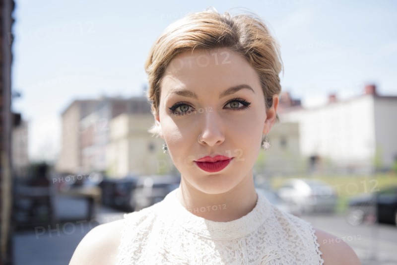 Serious Caucasian woman in city
