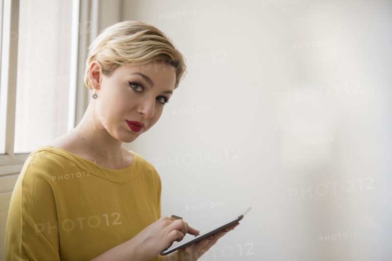 Caucasian woman using digital tablet