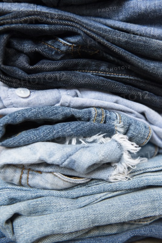 Stack of folded blue jeans