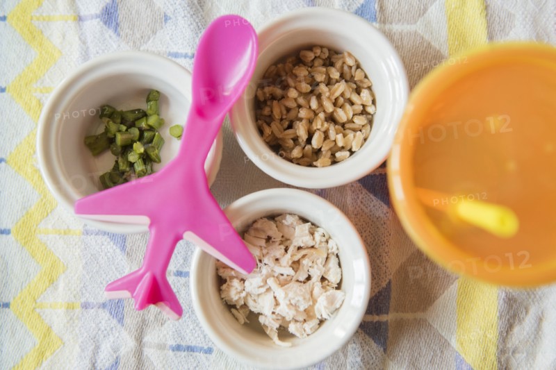 Airplane spoon on bowls of baby food