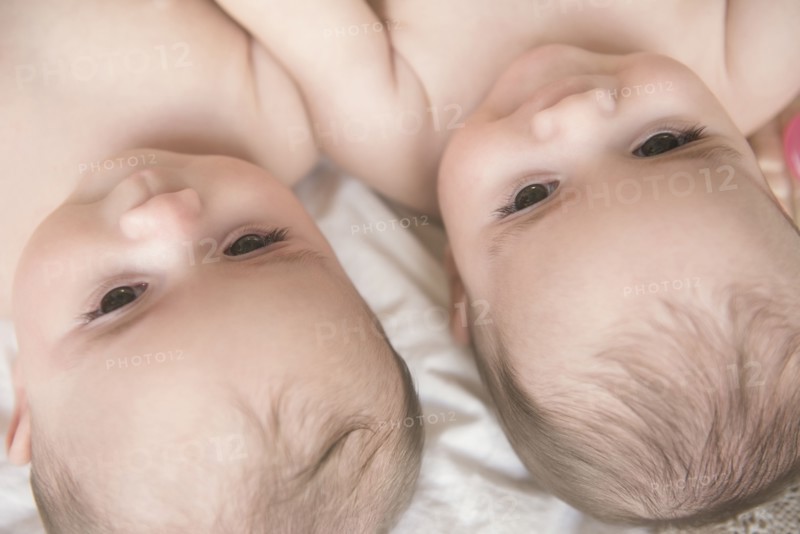 Faces of Caucasian twin baby girls