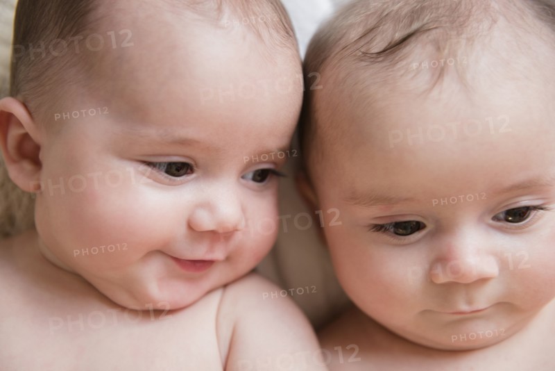 Faces of Caucasian twin baby girls