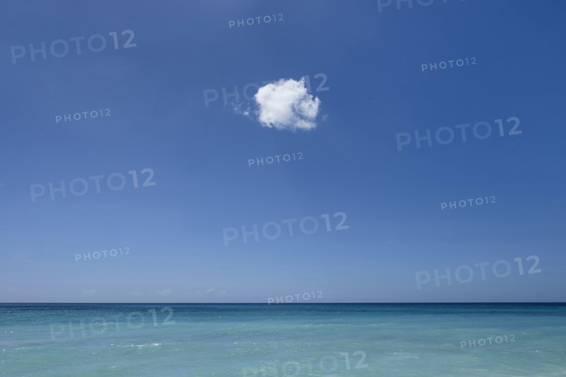 Cloud in blue sky over ocean