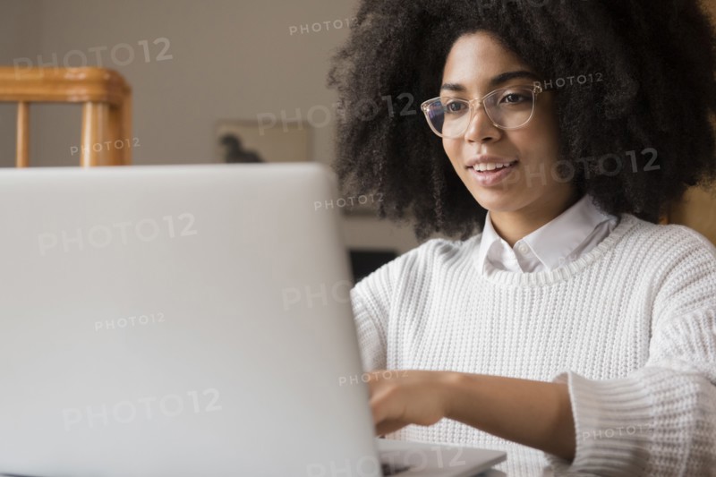 African American woman using laptop