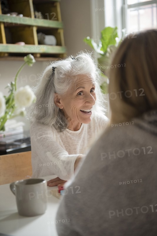 Older woman talking with daughter