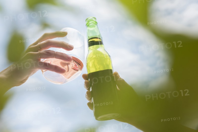 Women toasting with beer and wine