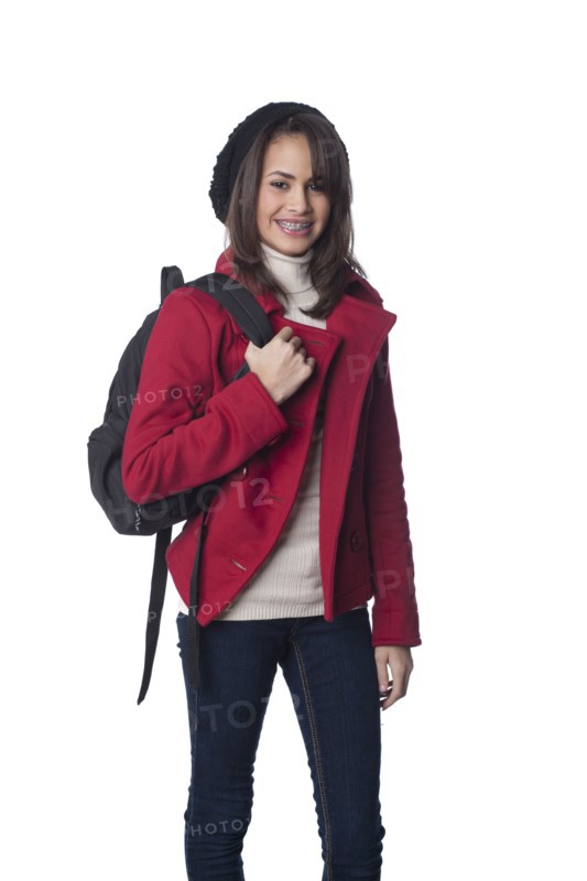 Mixed race teenager carrying backpack