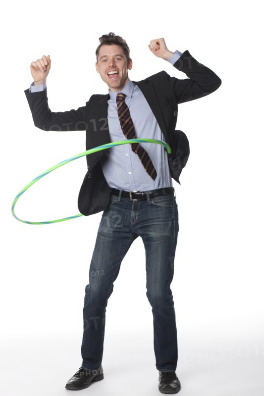 Caucasian businessman twirling plastic hoop