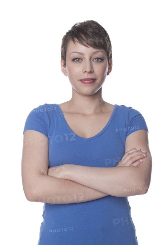 Smiling Hispanic woman with arms crossed