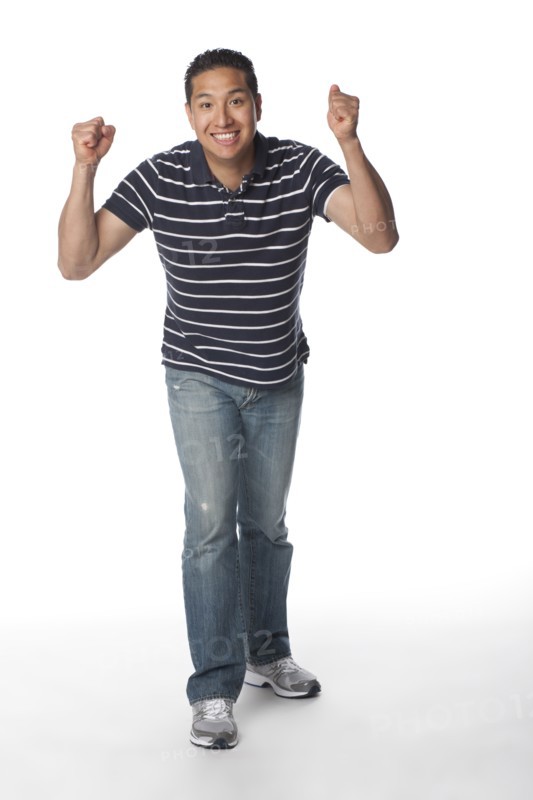 Smiling Hispanic man cheering