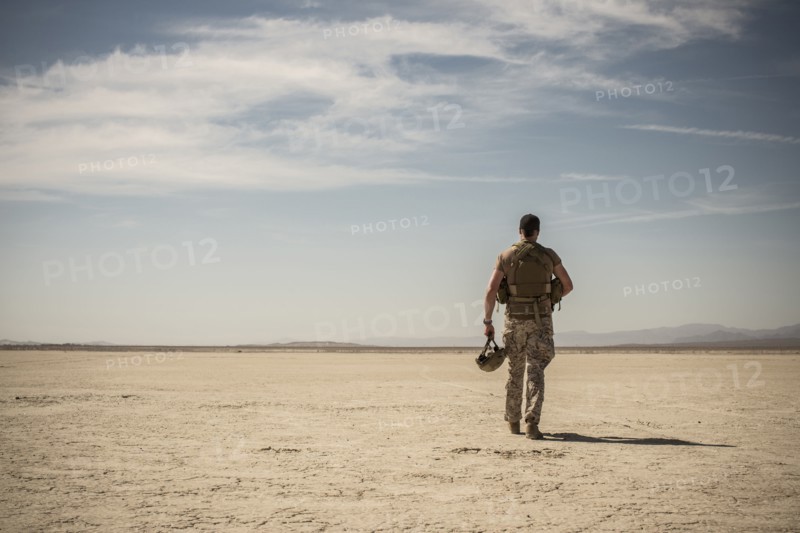 Soldier walking in remote desert