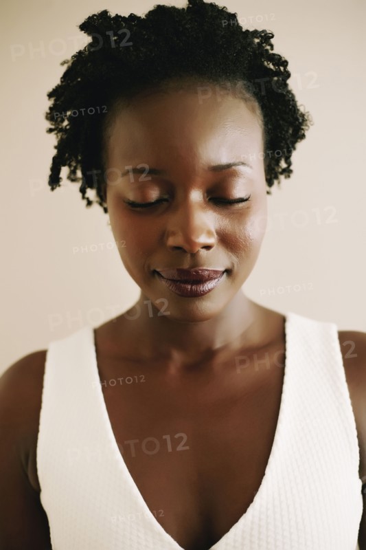 Black woman with eyes closed