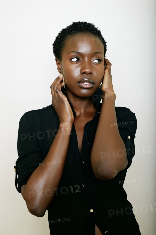 African American woman holding her face